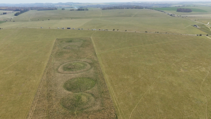 A bowl barrow and three bell barrows forming part of The Cursus